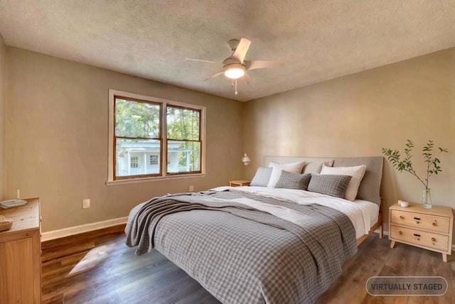 bedroom with dark wood-type flooring and ceiling fan