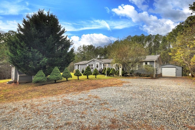 853 Stansbury Mountain Rd, Copperhill, TN 37317 - ranch-style house featuring an outbuilding, driveway, and a garage