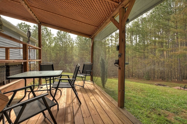 wooden terrace with a yard