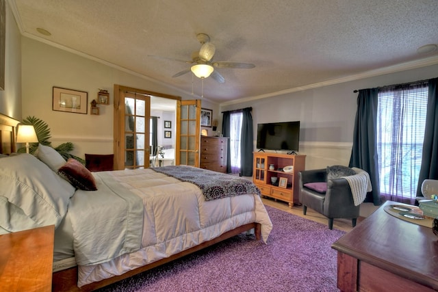 bedroom with ceiling fan, french doors, a textured ceiling, carpet, and ornamental molding