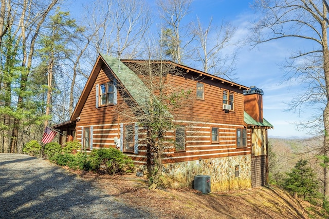 view of home's exterior with central AC