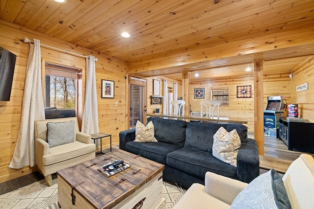 living room with wooden ceiling, light hardwood / wood-style floors, and wood walls