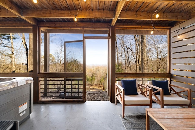 sunroom with wooden ceiling and beamed ceiling