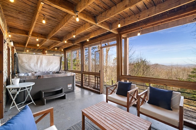 sunroom / solarium featuring wood ceiling