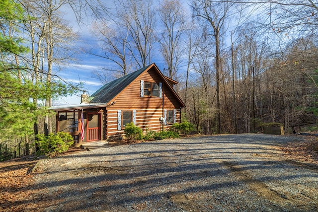 view of side of home featuring a porch