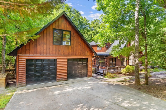 view of front of house featuring cooling unit and a garage