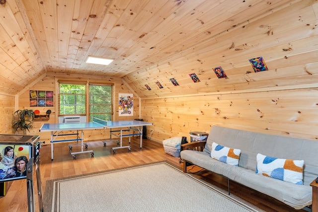 home office featuring lofted ceiling, hardwood / wood-style floors, wood ceiling, and wood walls