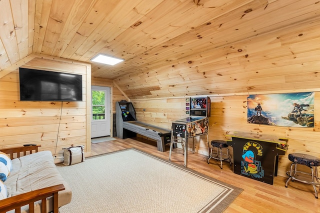 interior space with hardwood / wood-style flooring, vaulted ceiling, wooden ceiling, and wood walls