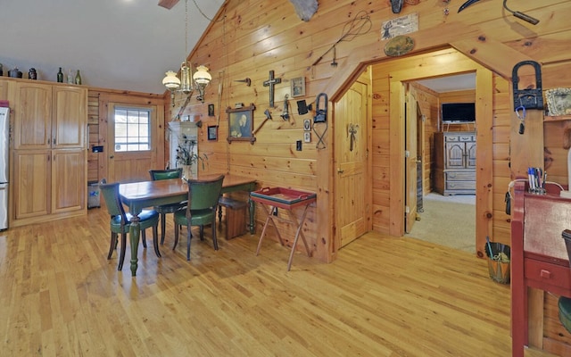 530 Bear Paw Church Rd, Murphy, NC 28906 - dining room with light wood-type flooring, wooden walls, and an inviting chandelier