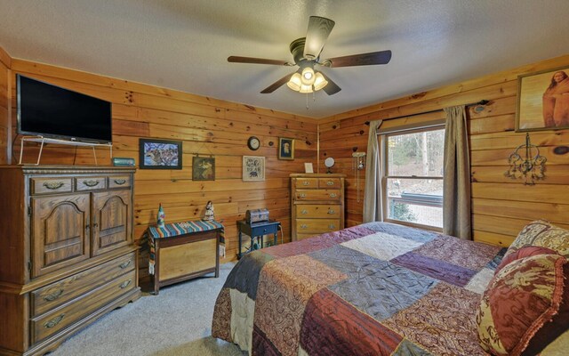 530 Bear Paw Church Rd, Murphy, NC 28906 - carpeted bedroom with wood walls, ceiling fan, and a textured ceiling