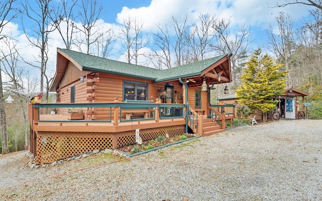 530 Bear Paw Church Rd, Murphy, NC 28906 - log home featuring a deck, roof with shingles, gravel driveway, and log siding