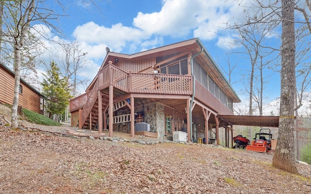 530 Bear Paw Church Rd, Murphy, NC 28906 - back of property with an attached carport, stone siding, and central air condition unit