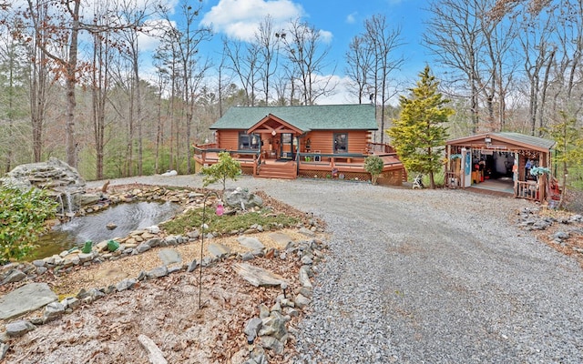 530 Bear Paw Church Rd, Murphy, NC 28906 - view of front of property with a deck, log exterior, a carport, and gravel driveway