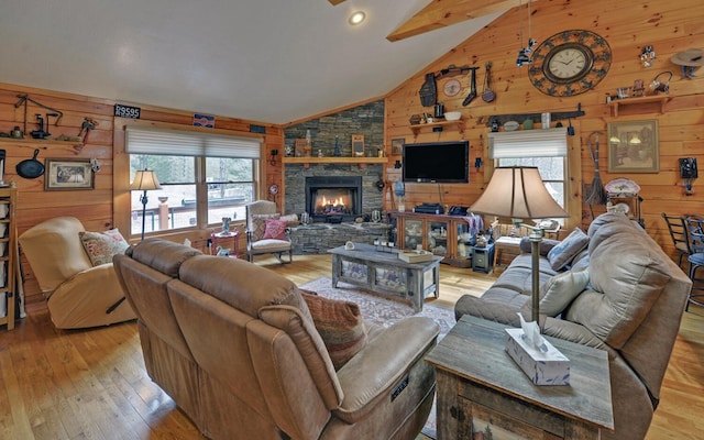530 Bear Paw Church Rd, Murphy, NC 28906 - living area featuring wood walls, light wood-style flooring, a fireplace, and high vaulted ceiling