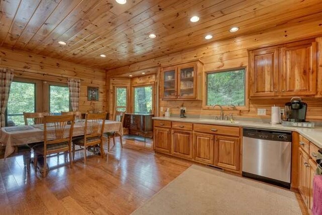 living room with wooden ceiling, a fireplace, wood-type flooring, high vaulted ceiling, and ceiling fan