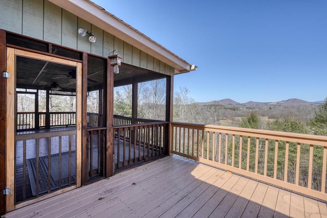 wooden deck with a mountain view