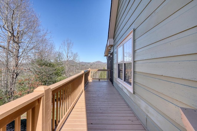 wooden terrace featuring a mountain view