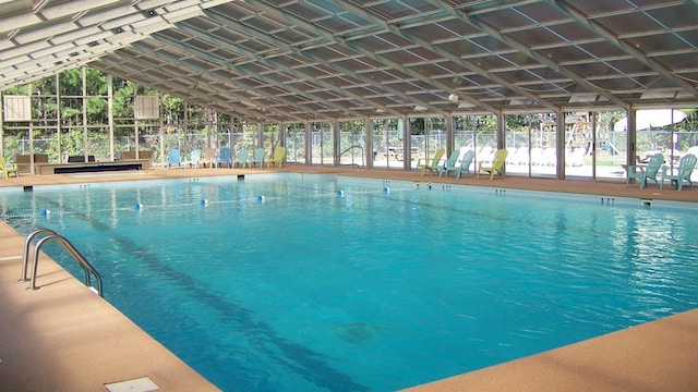 pool featuring a patio area and fence