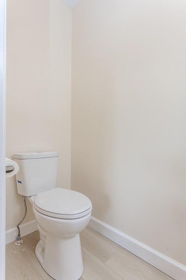 bathroom featuring toilet and hardwood / wood-style floors