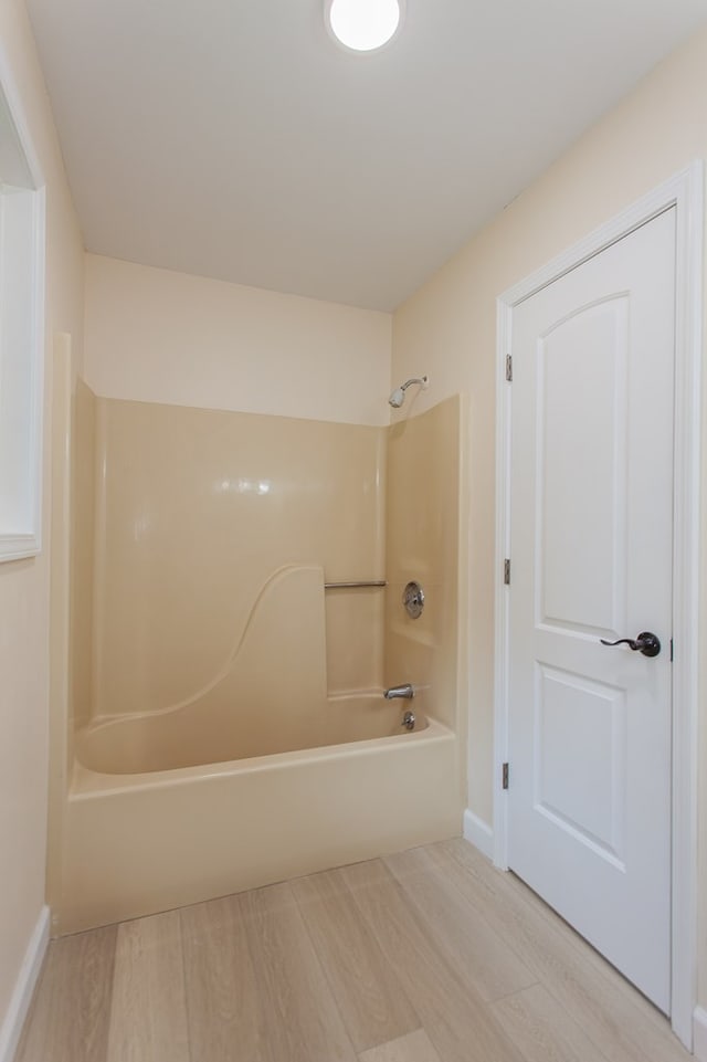 bathroom with bathing tub / shower combination