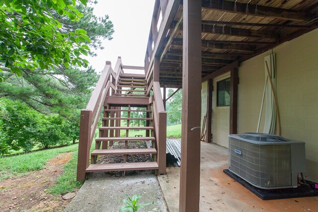 view of patio / terrace with a deck and central AC unit