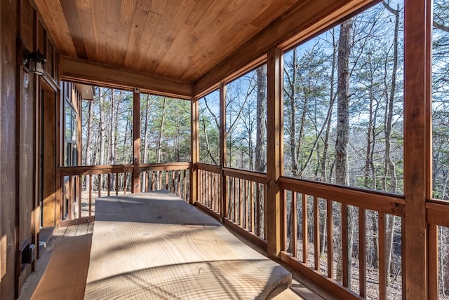 sunroom featuring wood ceiling