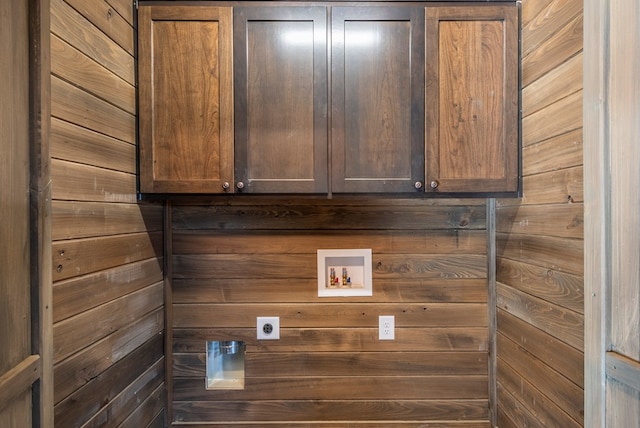 clothes washing area featuring cabinets, washer hookup, and hookup for an electric dryer