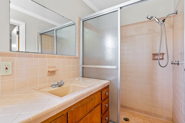 bathroom with backsplash, vanity, ornamental molding, and walk in shower