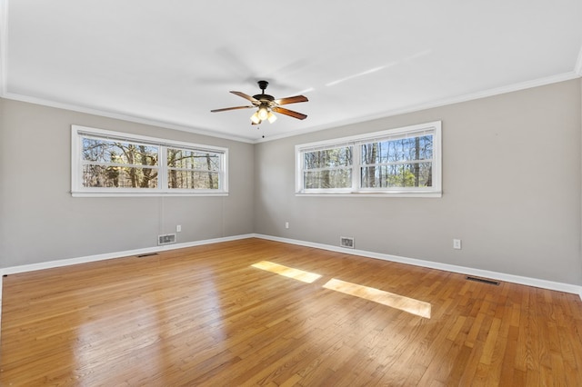 unfurnished room with ceiling fan, ornamental molding, and light hardwood / wood-style floors