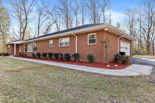 view of home's exterior featuring a garage and a lawn