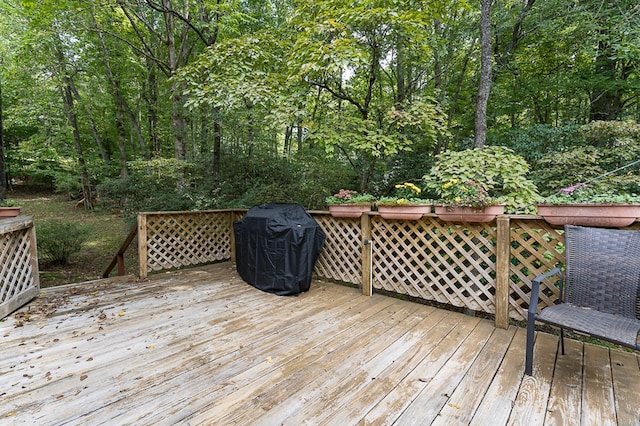 wooden deck featuring area for grilling