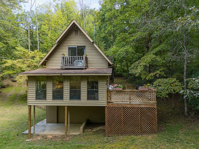 back of house with a yard and a patio area