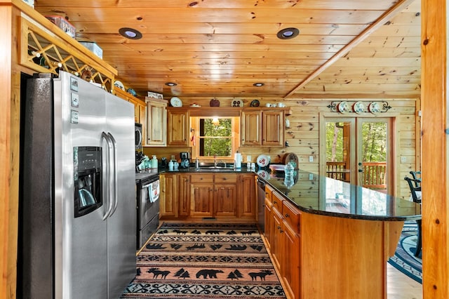 kitchen featuring stainless steel appliances, sink, wooden ceiling, dark stone countertops, and kitchen peninsula