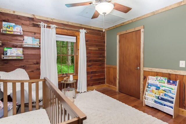 bedroom with hardwood / wood-style floors, wooden ceiling, and wooden walls