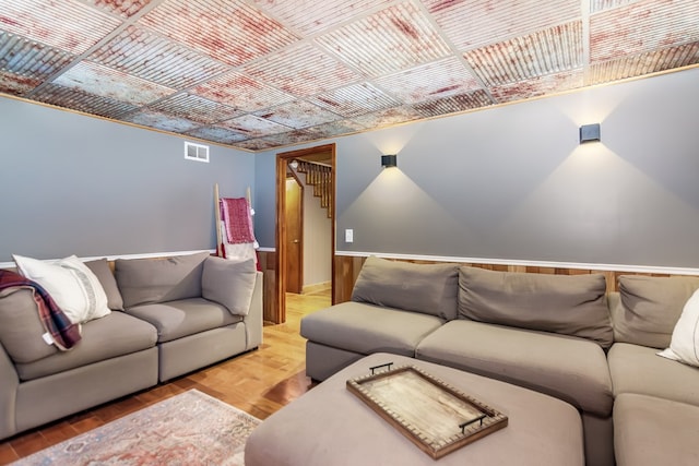 living room with visible vents and wood finished floors