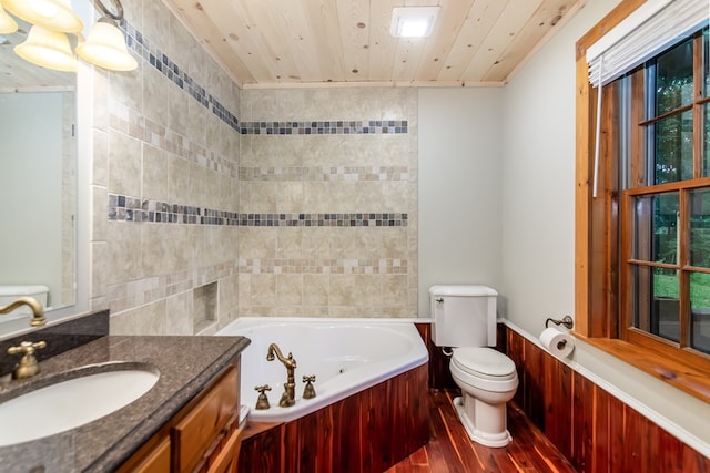 bathroom featuring toilet, vanity, wood finished floors, wooden ceiling, and a whirlpool tub