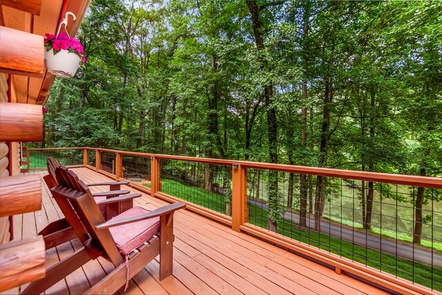 view of property's community featuring an outdoor fire pit