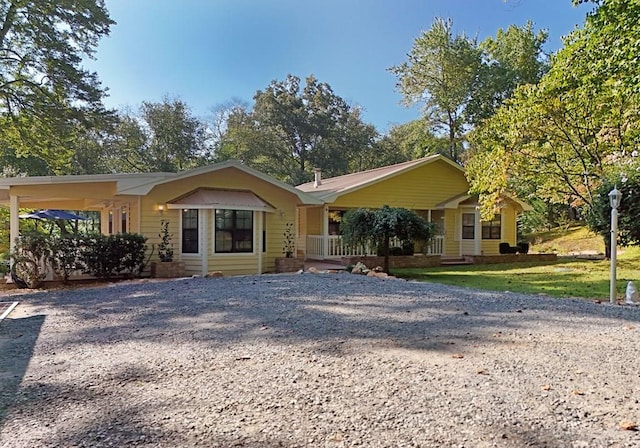 single story home featuring a carport