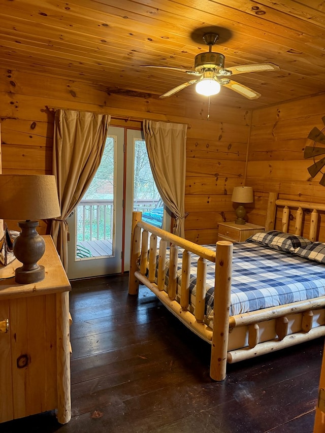 bedroom with wood walls, access to outside, wood ceiling, and dark wood-style floors