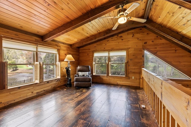 living area featuring plenty of natural light, wooden walls, hardwood / wood-style flooring, and wood ceiling
