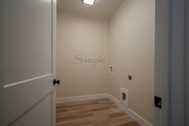 washroom featuring hookup for an electric dryer, hookup for a washing machine, and light wood-type flooring