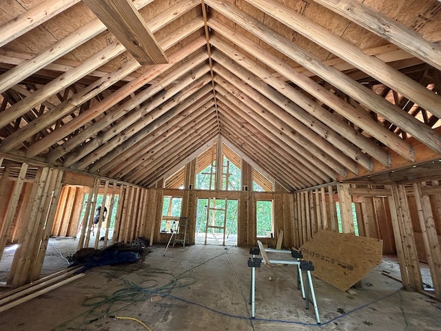 miscellaneous room with high vaulted ceiling