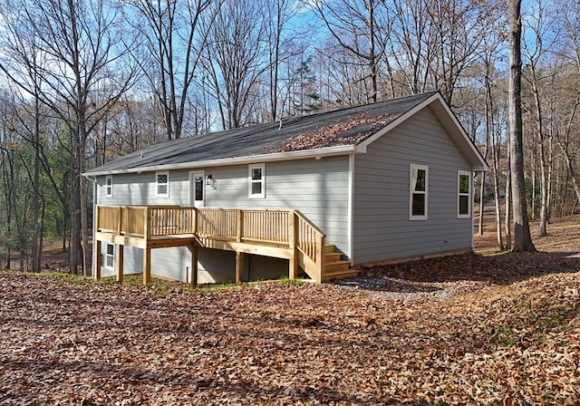 back of house featuring a deck