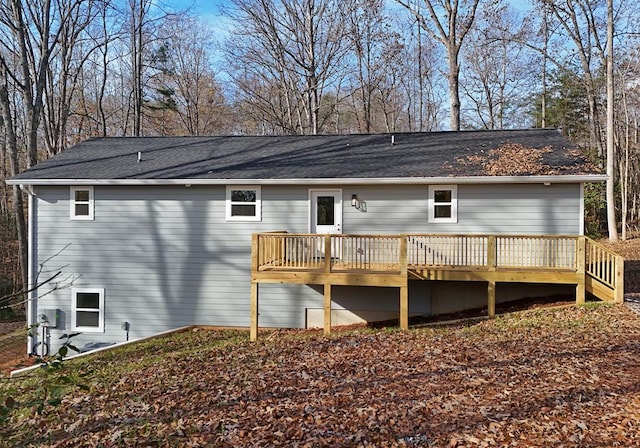 rear view of property with a wooden deck