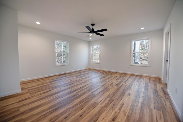 unfurnished room featuring ceiling fan and wood-type flooring