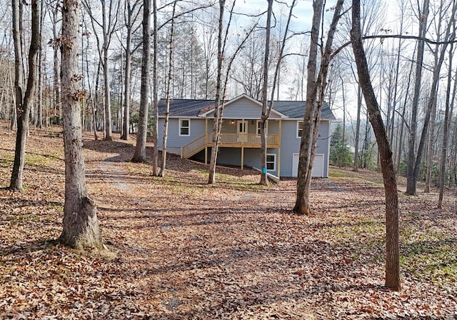 back of house with a wooden deck