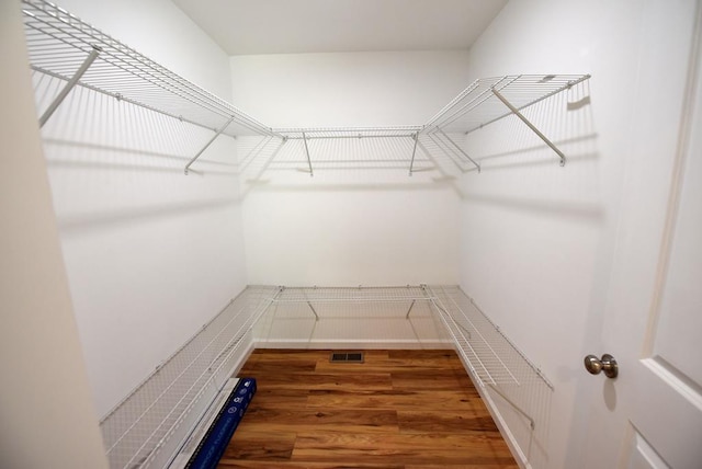 spacious closet featuring hardwood / wood-style floors