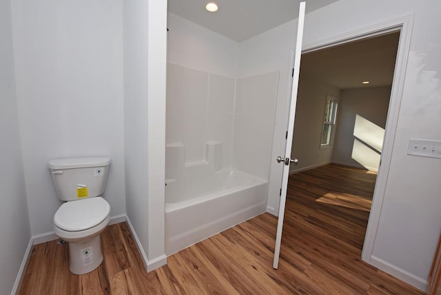 bathroom with wood-type flooring and toilet