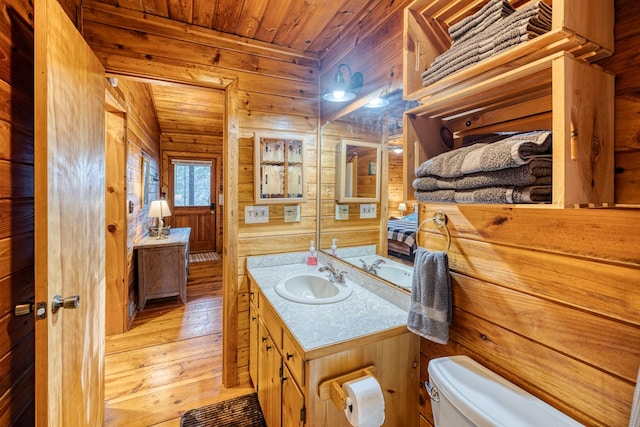 57 Coffee Pot Dr, Blue Ridge, GA 30513 - bathroom with wood ceiling, toilet, wood walls, hardwood / wood-style flooring, and vanity