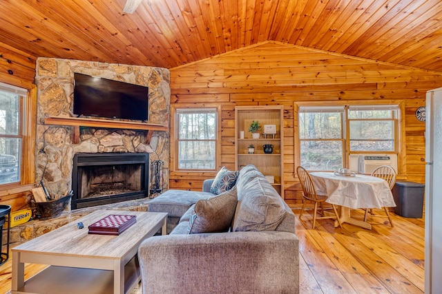 57 Coffee Pot Dr, Blue Ridge, GA 30513 - living room featuring vaulted ceiling, wood walls, wood-type flooring, plenty of natural light, and a fireplace